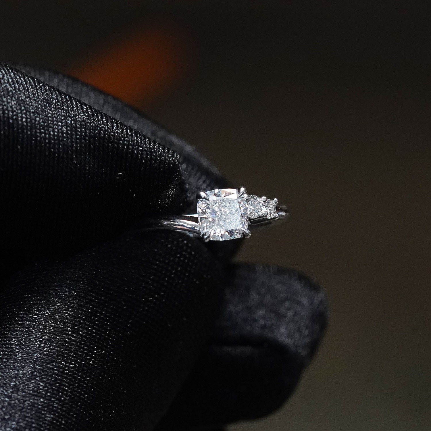 CUSTOM | Cushion Cut & Two Side Stones in 18ct White Gold – side view