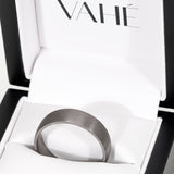 Dark ring in a box with 'VAHE' branding
