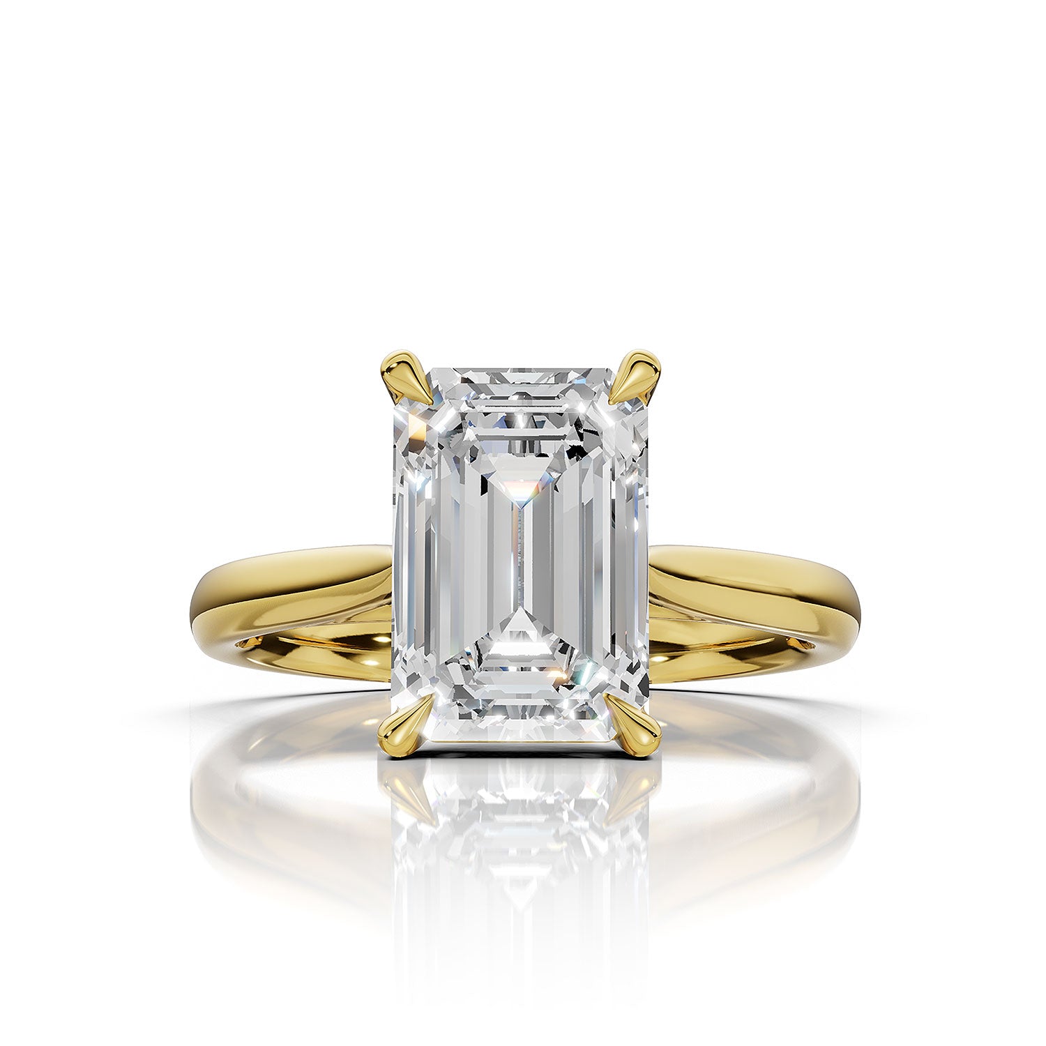 An emerald-cut diamond ring set in yellow gold, featuring a brilliant center stone and a polished shank, shown on a clean white background with a soft reflection below.