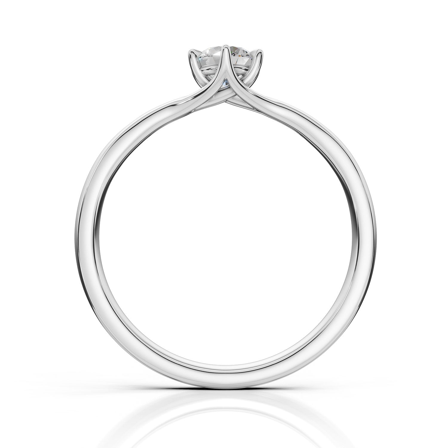 A silver solitaire engagement ring with a round brilliant-cut diamond set in a four-prong crown, shown on a clean white background with a soft reflection below.