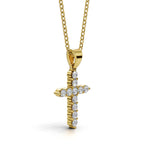 ELENA round brilliant diamond cross pendant in yellow gold, 0.20ct total weight, side view showing shared prong setting and bail