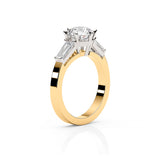 EMMA | Round Brilliant & Tapered Baguette Diamond Ring in Yellow & White Gold