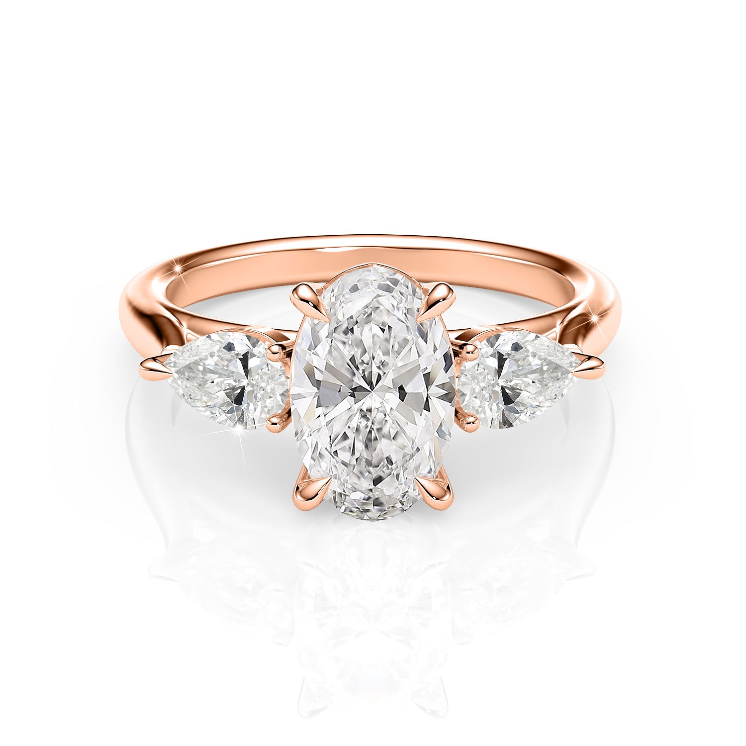 Rose gold ring with a central diamond and two smaller diamonds on a white background