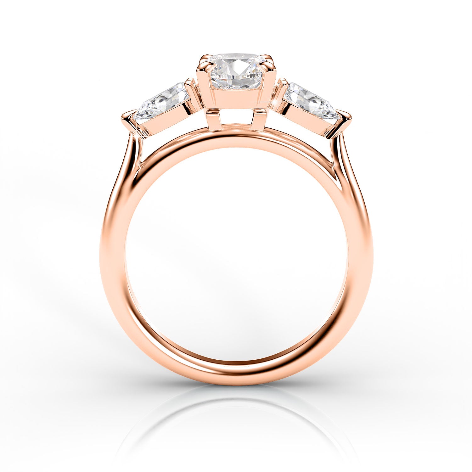 Rose gold ring with three diamonds on a white background