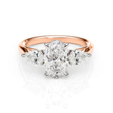 Rose gold and white gold ring with a diamond on a white background