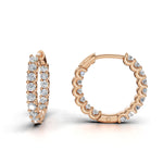 ILAYDA claw set diamond huggie earrings in rose gold, 0.90ct total weight, angled side view