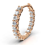 ILAYDA claw set diamond huggie earrings in rose gold, 0.90ct total weight, close-up of the scalloped claw setting