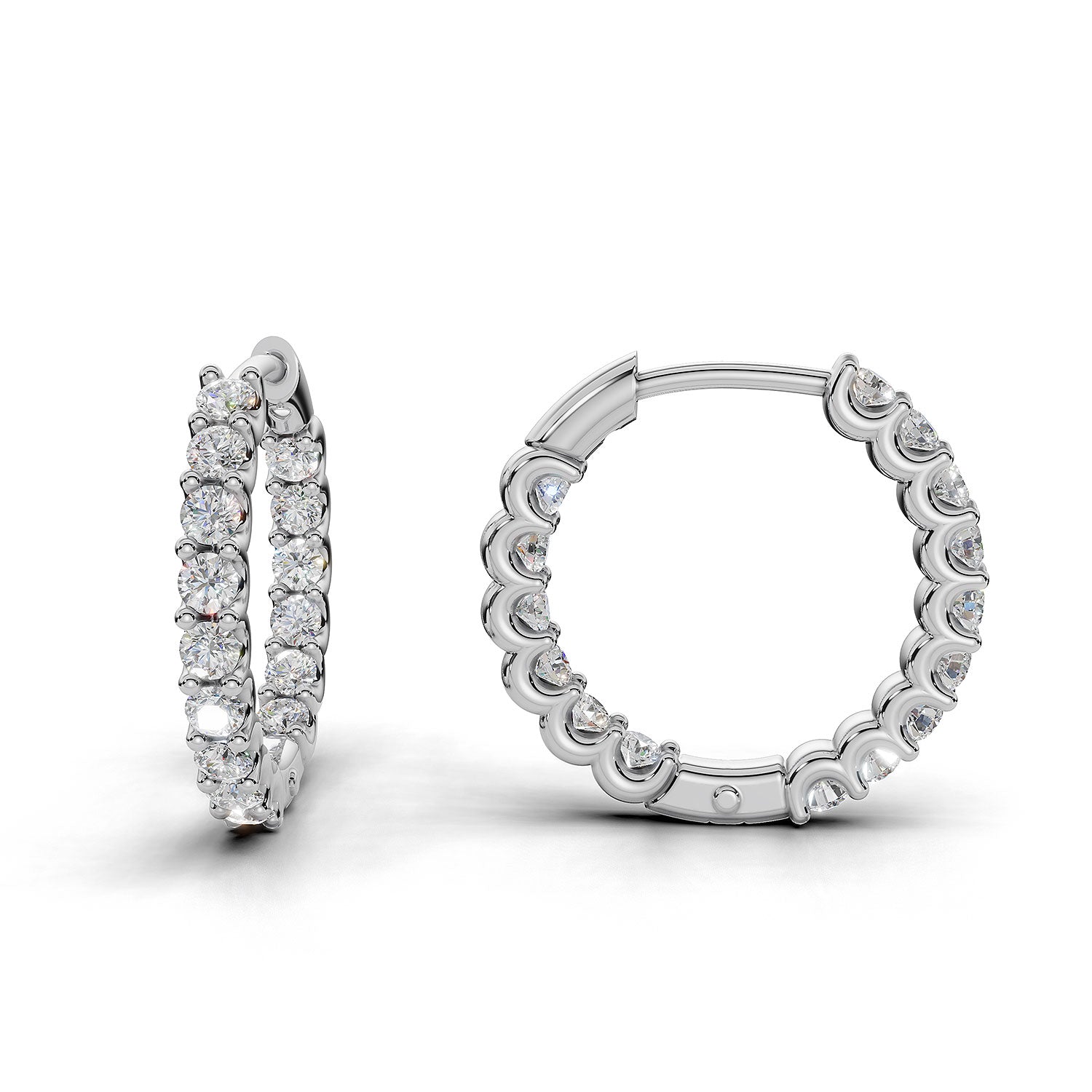 ILAYDA claw set diamond huggie earrings in white gold, 0.90ct total weight, angled side view