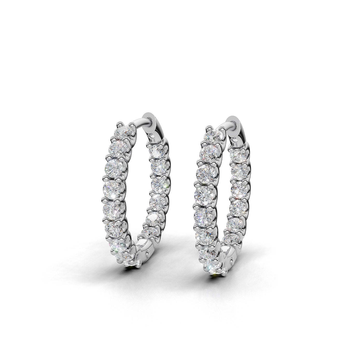ILAYDA claw set diamond huggie earrings in white gold, 0.90ct total weight, side view