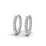 ILAYDA claw set diamond huggie earrings in white gold, 0.90ct total weight, side view