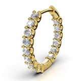 ILAYDA claw set diamond huggie earrings in yellow gold, 0.90ct total weight, close-up of the scalloped claw setting