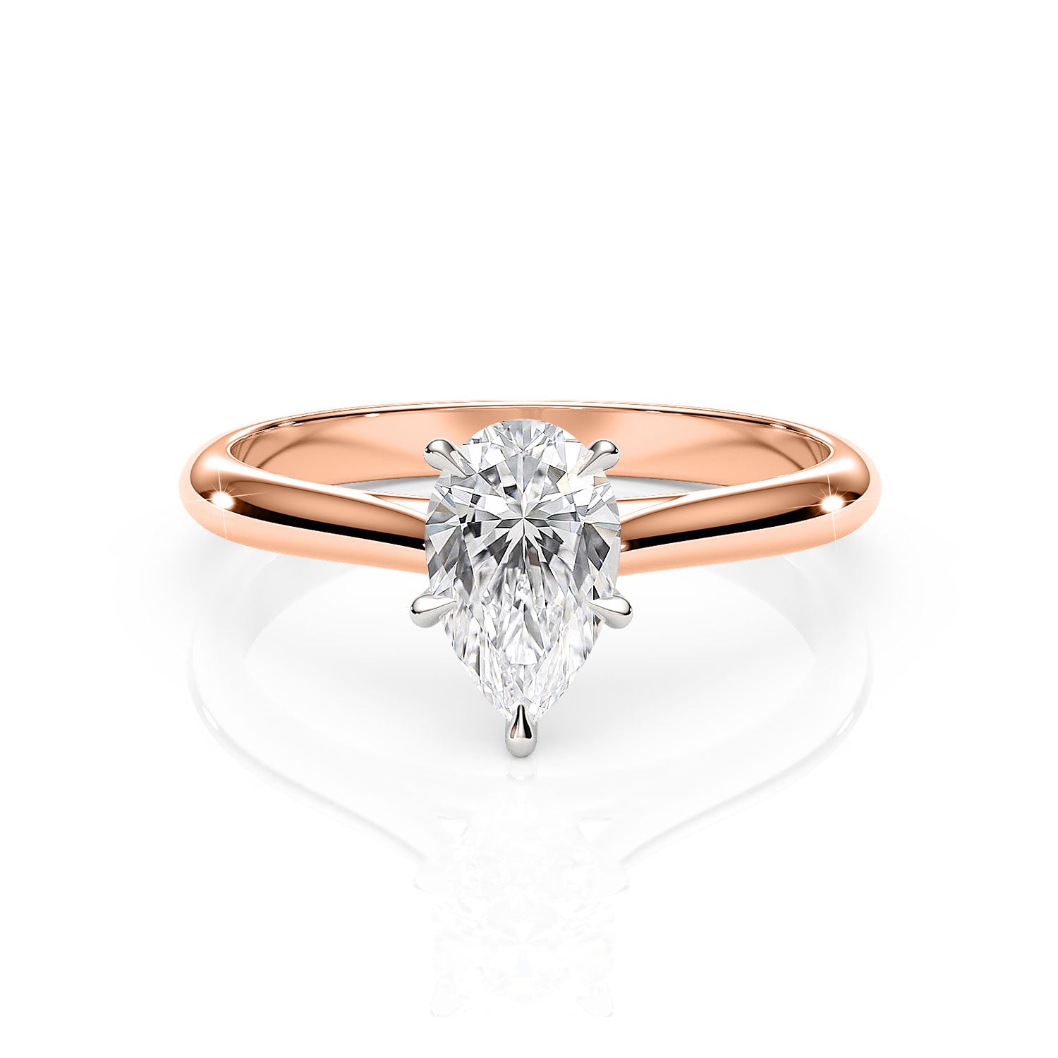 Rose gold ring with a pear-shaped diamond on a white background