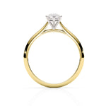 Gold ring with a diamond on a white background