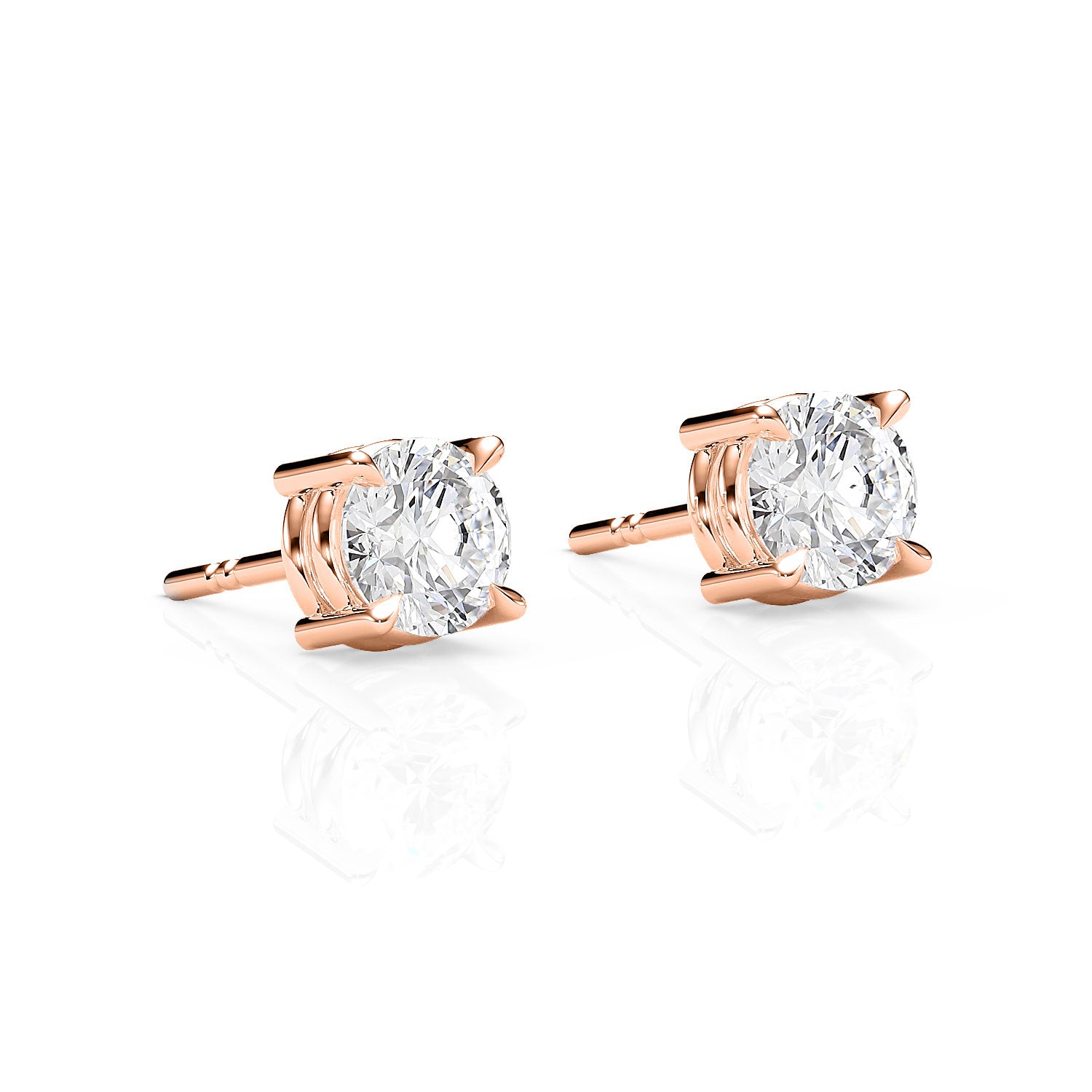 Rose gold stud earrings with clear gemstones on a white background