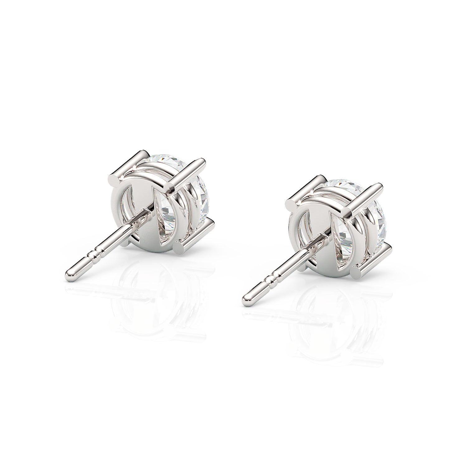 Pair of silver stud earrings on a white background