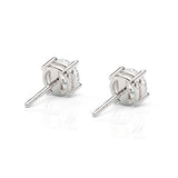 Pair of silver stud earrings on a white background