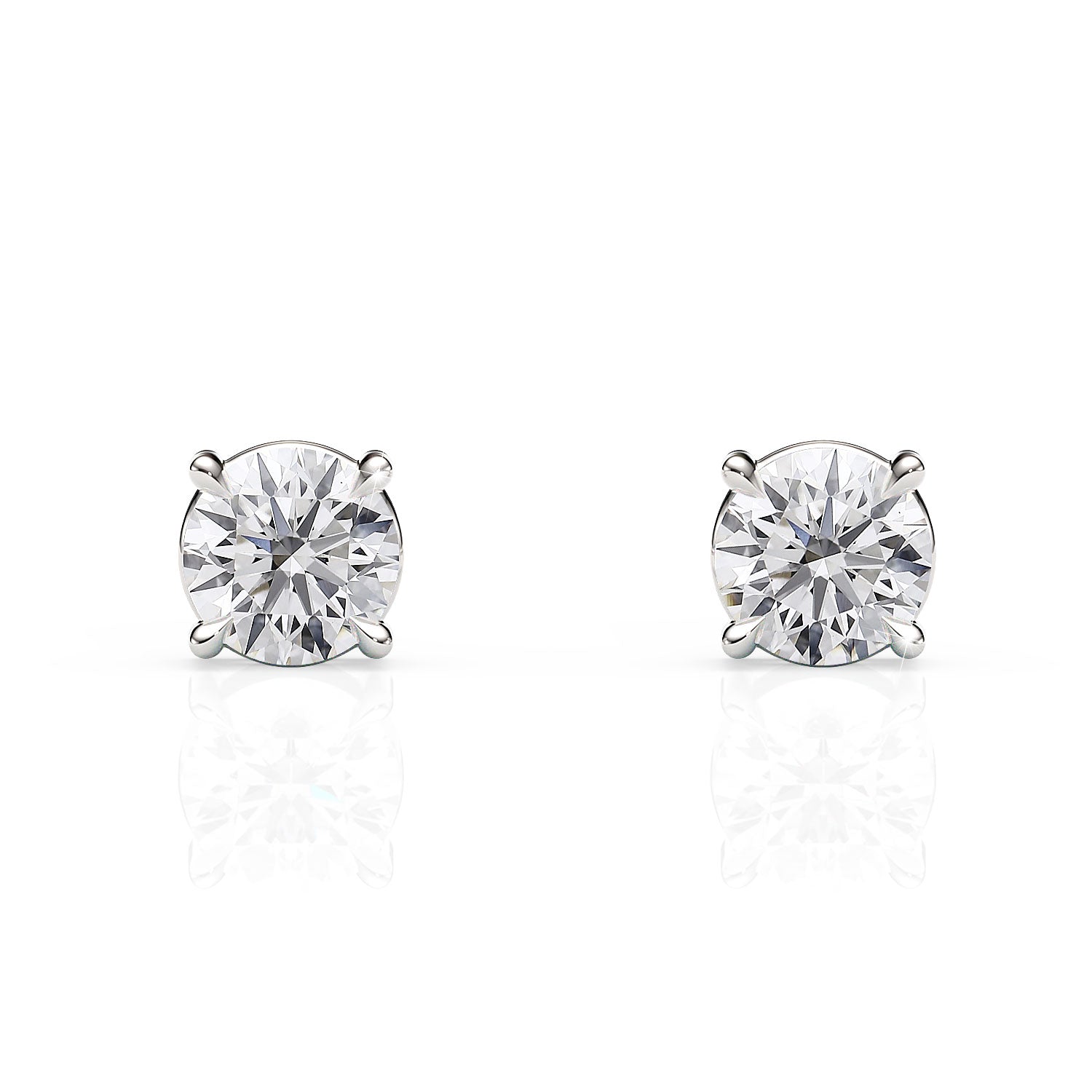 Pair of diamond stud earrings on a white background