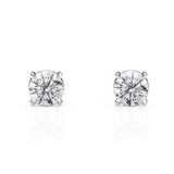 Pair of diamond stud earrings on a white background