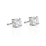 Pair of diamond stud earrings on a white background