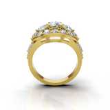 A yellow gold ring with a cluster of clear gemstones on the top, shown from a front-facing angle against a white background with a soft reflection below.