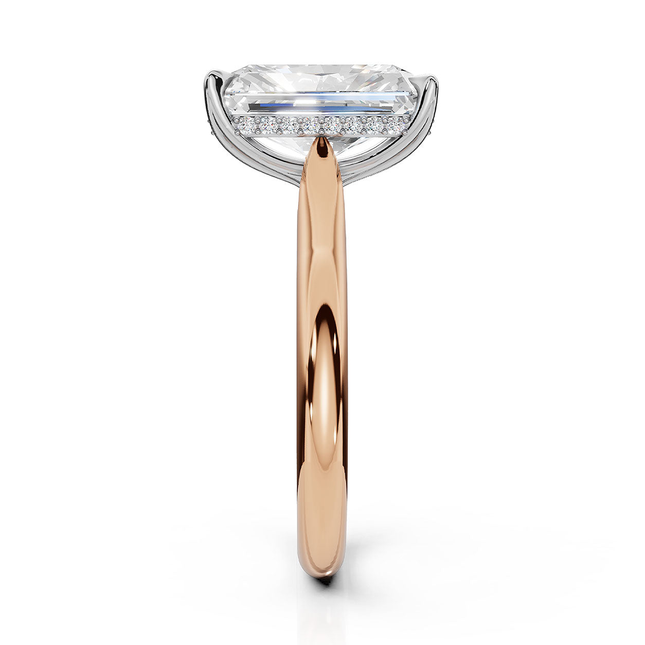 An engagement ring featuring a large rectangular emerald-cut diamond on a polished rose gold band with a halo of small round diamonds, shown against a solid white background.
