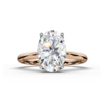 An oval-cut diamond engagement ring with an oval-cut center stone and a polished rose gold band, shown on a clean white background.