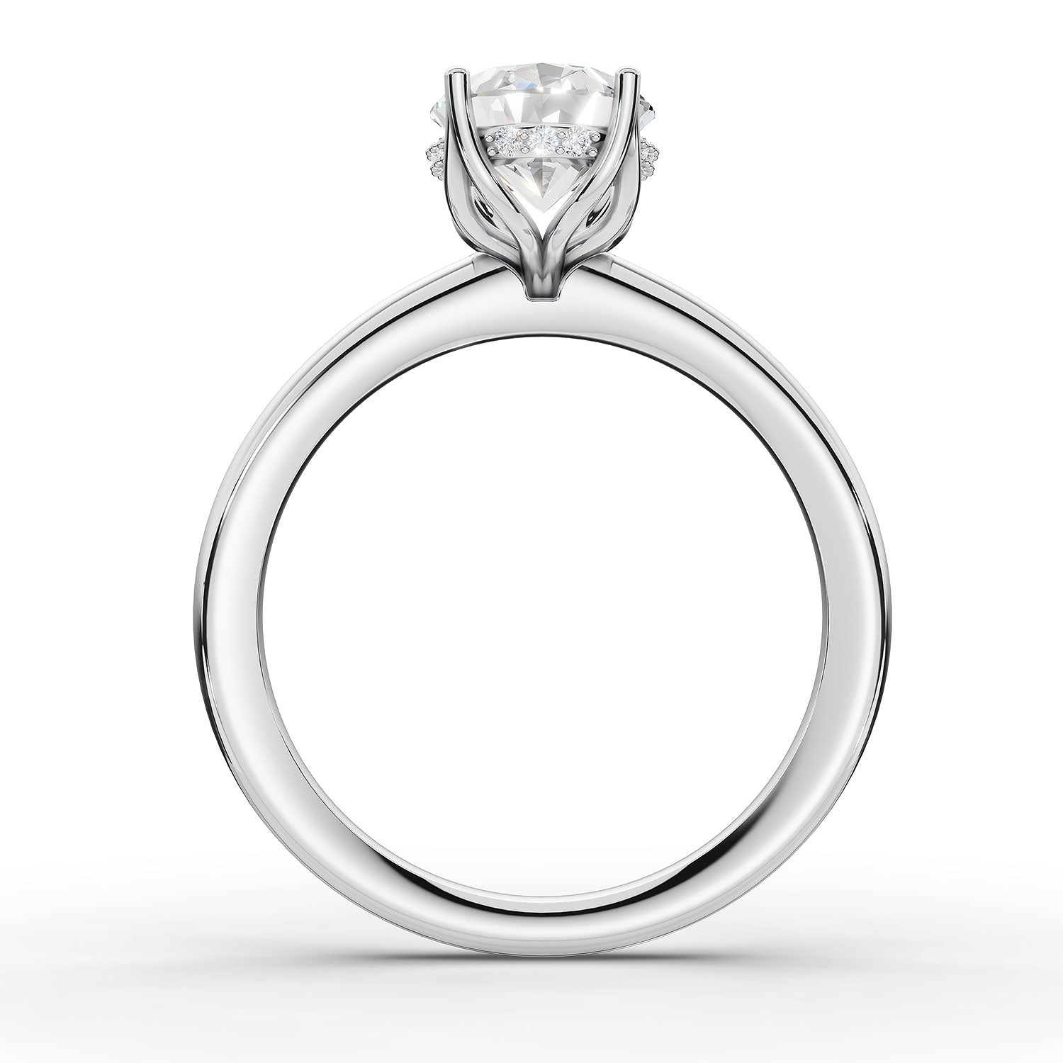 A classic solitaire engagement ring featuring a round brilliant-cut diamond set in a four-prong white gold or platinum band, shown on a clean white background.