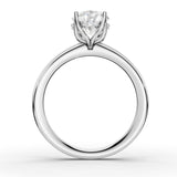 A classic solitaire engagement ring featuring a round brilliant-cut diamond set in a four-prong white gold or platinum band, shown on a clean white background.