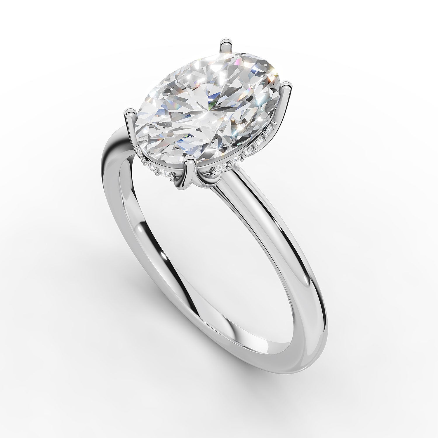 A silver engagement ring featuring a large oval-cut clear gemstone in a prong setting, accented by a halo of small round stones on a clean white background.
