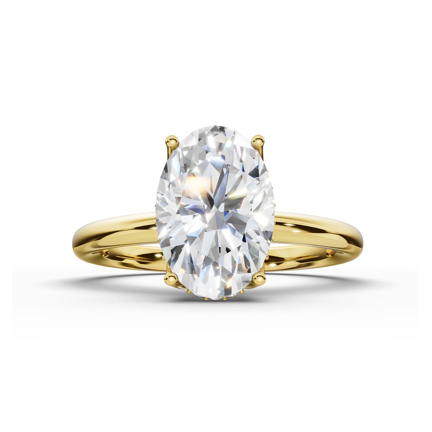 An oval-cut diamond engagement ring with a yellow gold band, shown on a clean white background with a soft shadow.
