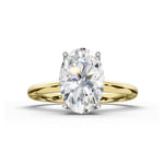 An oval-cut diamond engagement ring with a yellow gold band, shown on a clean white background.