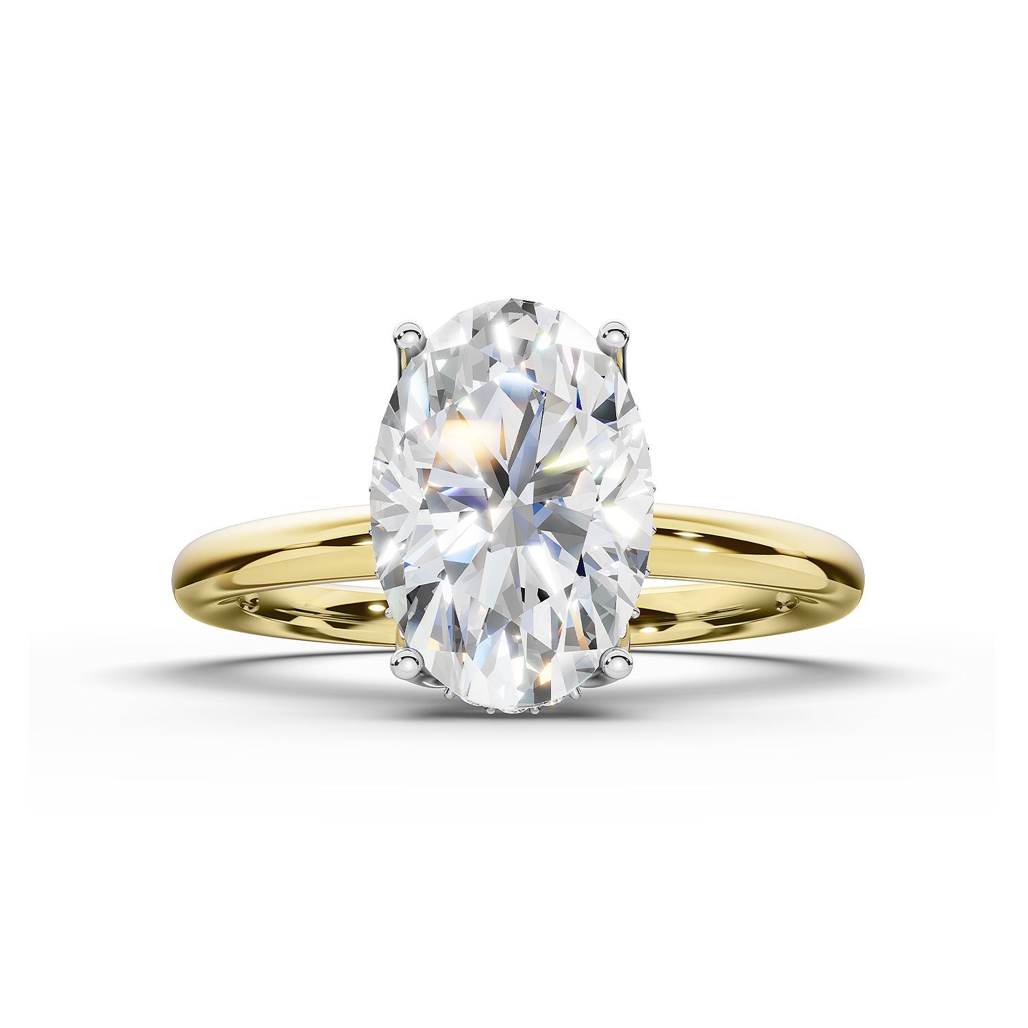 An oval-cut diamond engagement ring with a yellow gold band, shown on a clean white background.