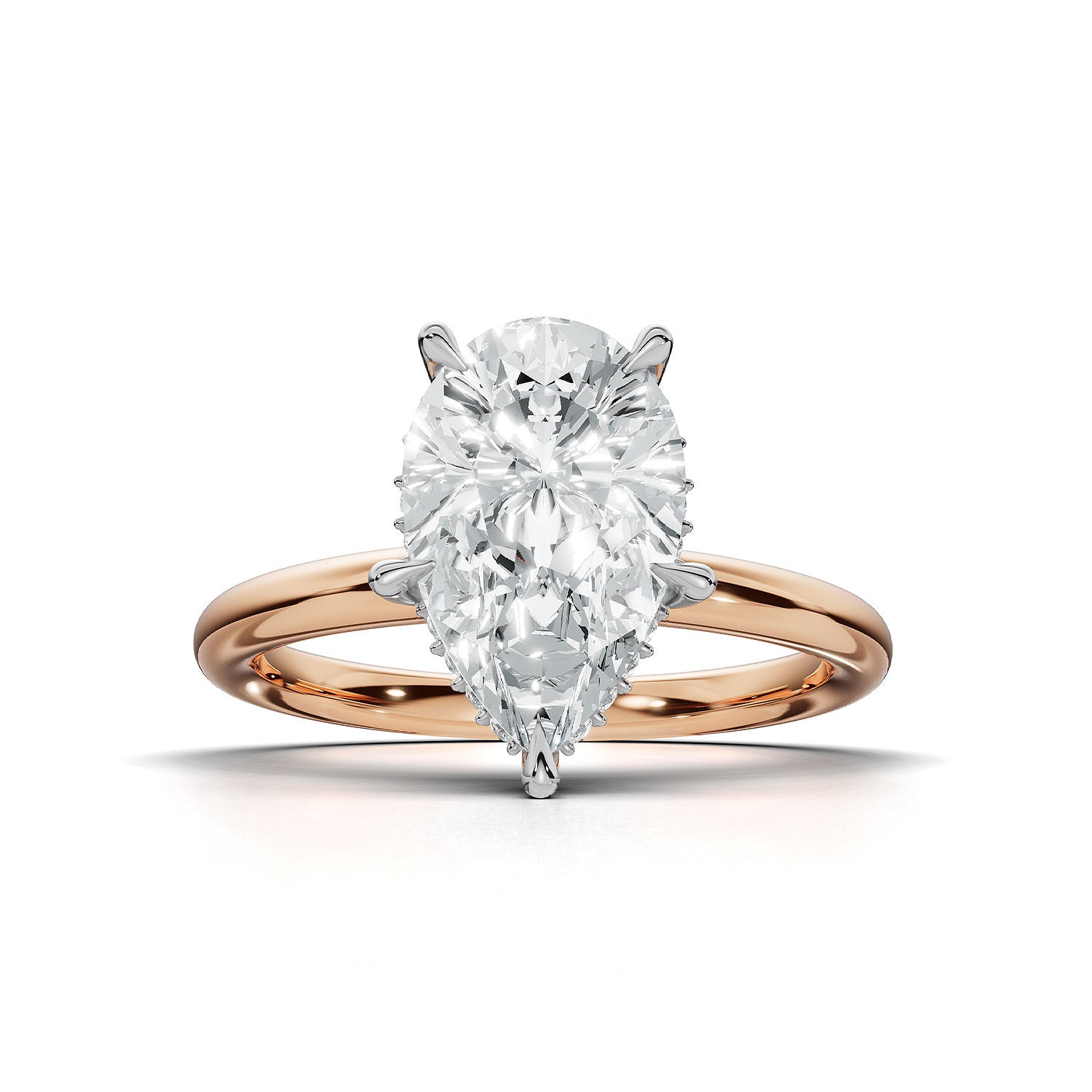 A pear-cut diamond engagement ring in a rose gold setting, shown on a clean white background with a soft shadow.