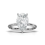 A pear-cut diamond solitaire engagement ring in a polished four-prong white gold or platinum setting, centered on a clean white background with a soft shadow.