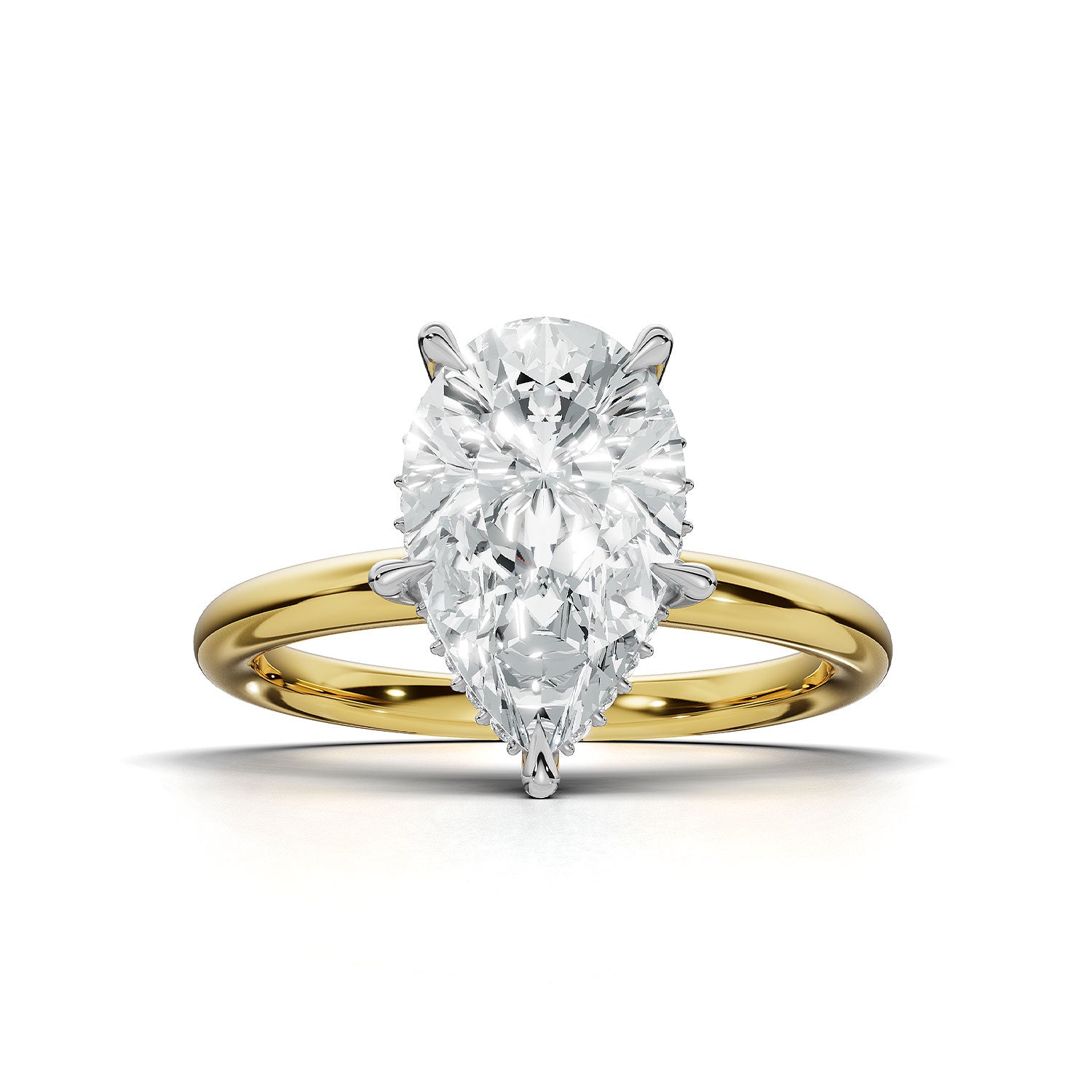 A pear-cut diamond engagement ring with a yellow gold band and white gold prongs, centered on a clean white background.