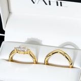 WILLOW east-west marquise diamond ring in 18ct yellow gold with a matching curved wedding band, inside an open VAHÉ ring box